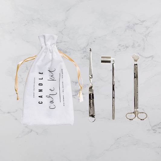 Candle care kit accessories laid out, tools for proper candle maintenance and extending candle life