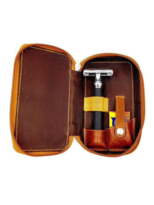 Saddle brown leather safety razor travel case open showing padded interior, genuine leather zippered case