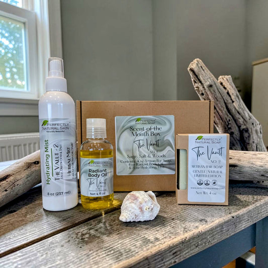 Scent of the Month variety box contents showing natural soap and body care products from Perfectly Natural Soap