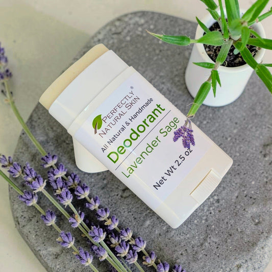 Lavender Sage Natural Deodorant lying on a stone display 