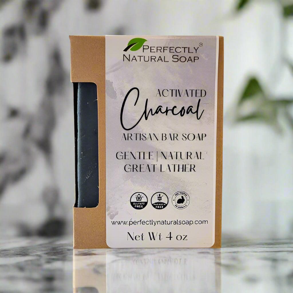 Activated charcoal natural soap bar close-up showing rich black detoxifying lather, handmade soap for pore cleansing
