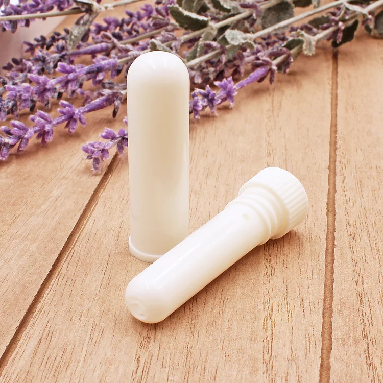 Essential oil inhaler tube components showing wick, plug and outer shell for DIY aromatherapy inhaler