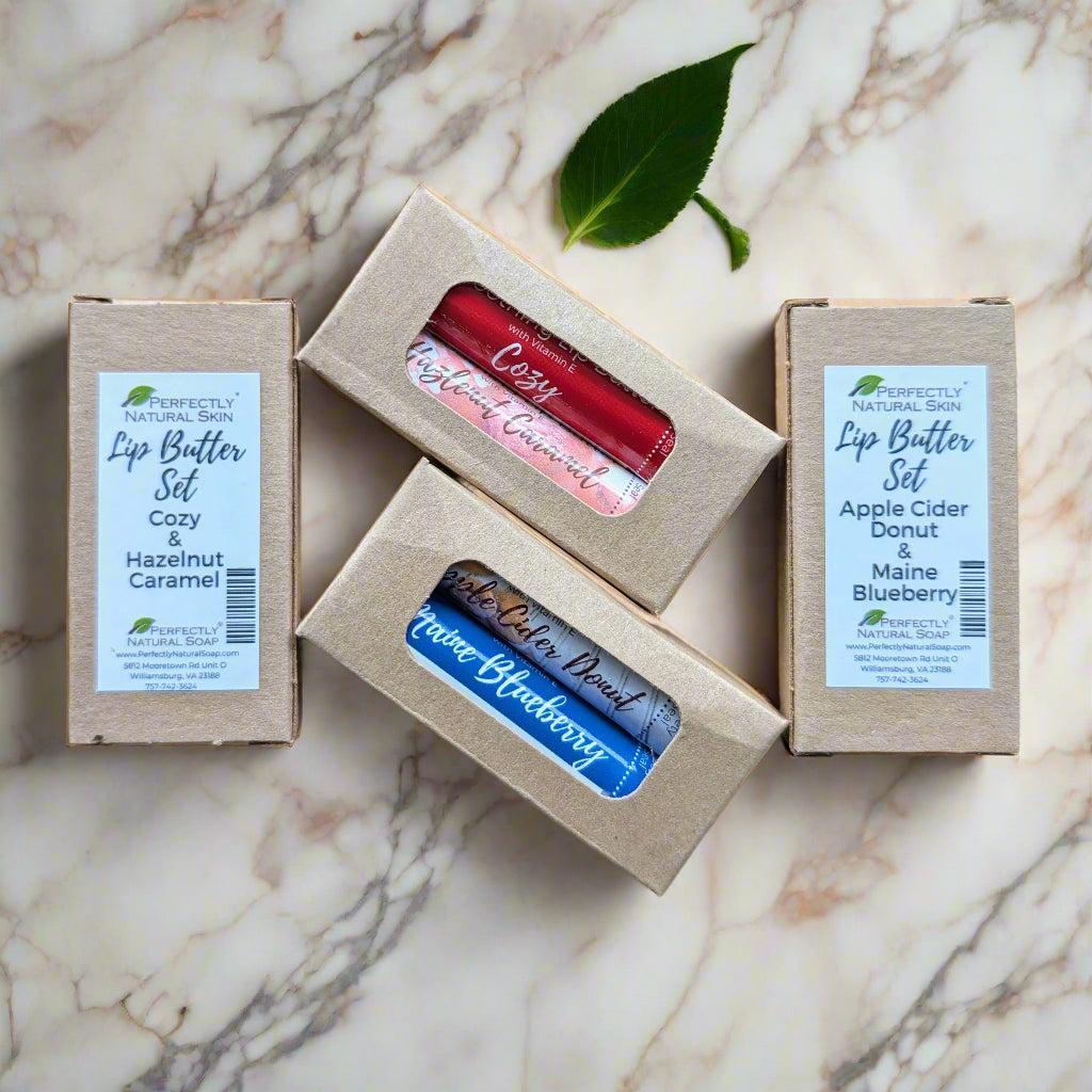 Natural lip butter 2-stick set in Butterbeer and Cinnamon Swizzle scents, moisturizing flavored lip balm set