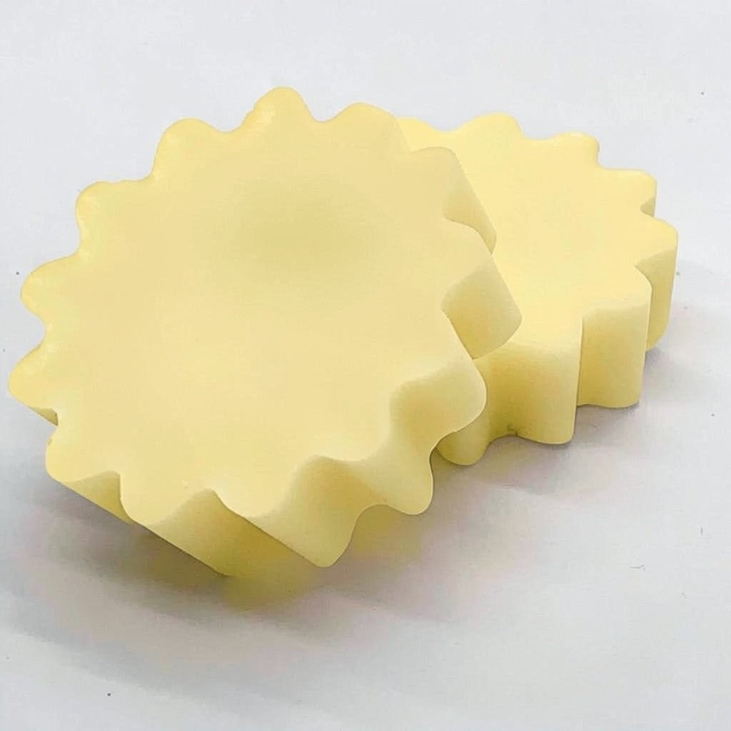 Wax tart individual 0.75 oz in wax warmer releasing fragrance, scented wax melt in use