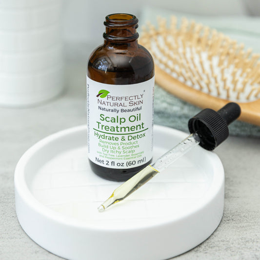 Scalp oil treatment 2 oz in use, natural botanical oil for promoting healthy scalp and strong hair growth