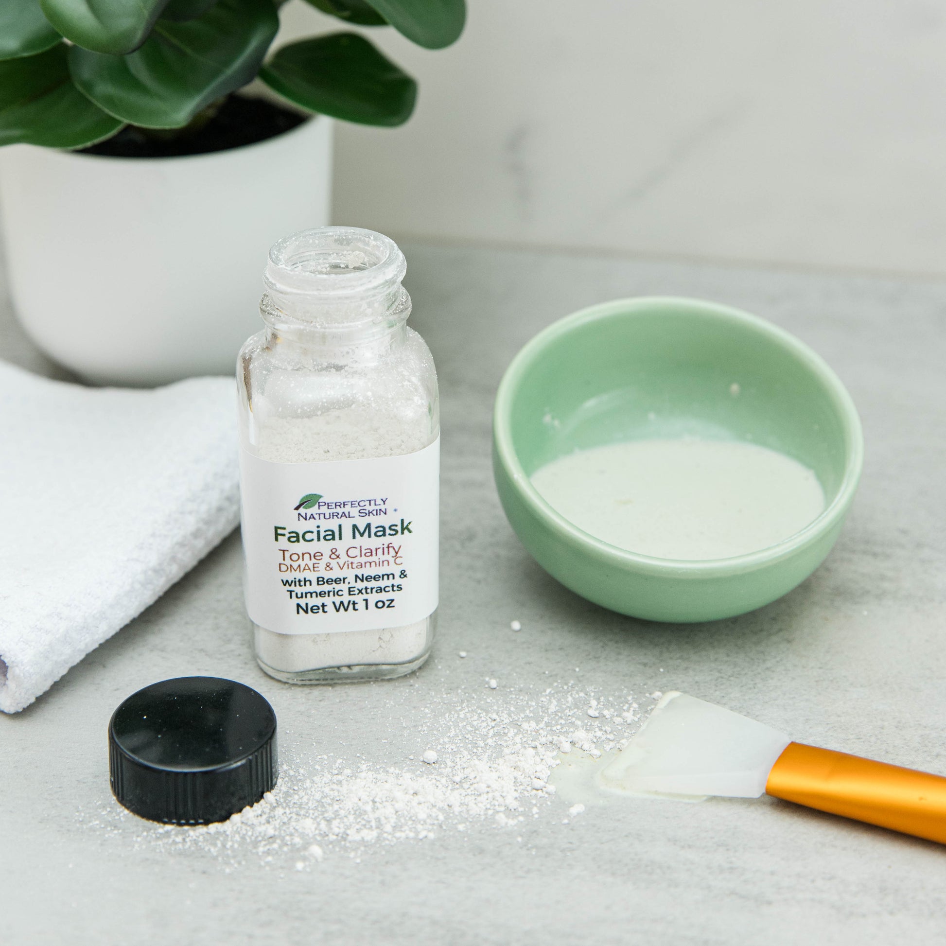 Tone and Clarify DMAE vitamin C facial mask in use, natural brightening mask for even glowing skin